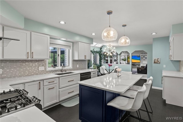 5103 Eastbrooke Pl, Clarence, NY 14221 - kitchen featuring a center island, a chandelier, light countertops, tasteful backsplash, and recessed lighting