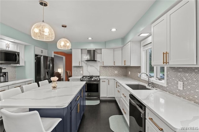 5103 Eastbrooke Pl, Clarence, NY 14221 - kitchen with appliances with stainless steel finishes, blue cabinetry, wall chimney range hood, backsplash, and white cabinets