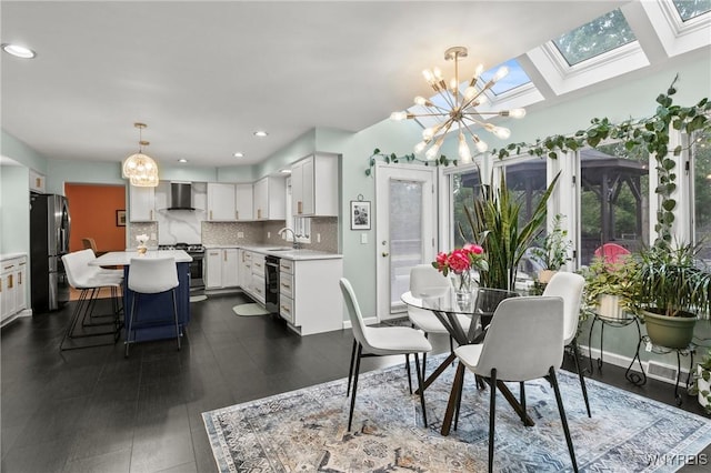 5103 Eastbrooke Pl, Clarence, NY 14221 - dining room with a chandelier, a skylight, and recessed lighting