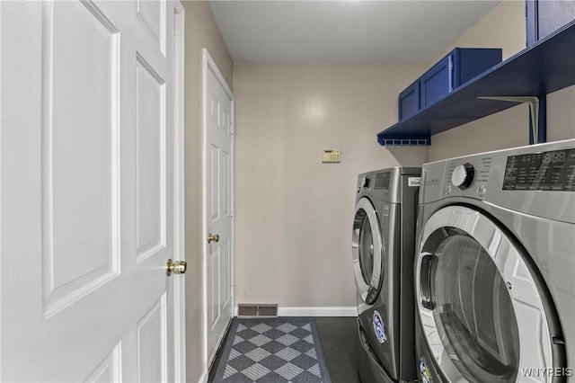 5103 Eastbrooke Pl, Clarence, NY 14221 - laundry room with independent washer and dryer and dark tile patterned flooring