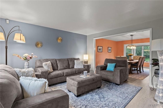5103 Eastbrooke Pl, Clarence, NY 14221 - living area with light wood finished floors and a chandelier