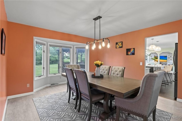 5103 Eastbrooke Pl, Clarence, NY 14221 - dining space featuring light wood-type flooring and baseboards