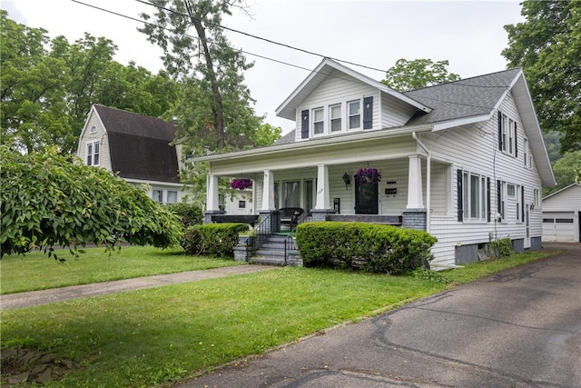 109 Oakwood Ave, Elmira, NY 14903 - view of front facade featuring covered porch, an outbuilding, a garage, and a front yard