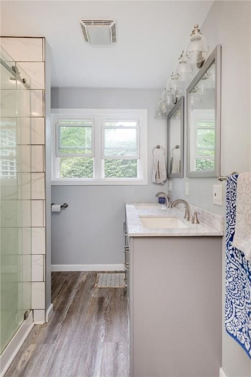 109 Oakwood Ave, Elmira, NY 14903 - full bath featuring vanity, wood finished floors, and a stall shower