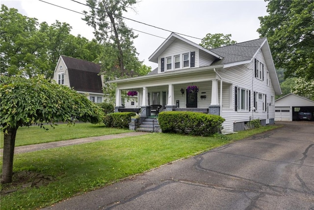 109 Oakwood Ave, Elmira, NY 14903 - view of front of house featuring an outbuilding, a porch, a garage, and a front lawn