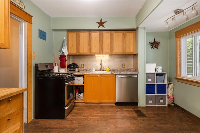 109 Oakwood Ave, Elmira, NY 14903 - kitchen with stainless steel appliances, dark wood-style flooring, decorative backsplash, and light stone countertops