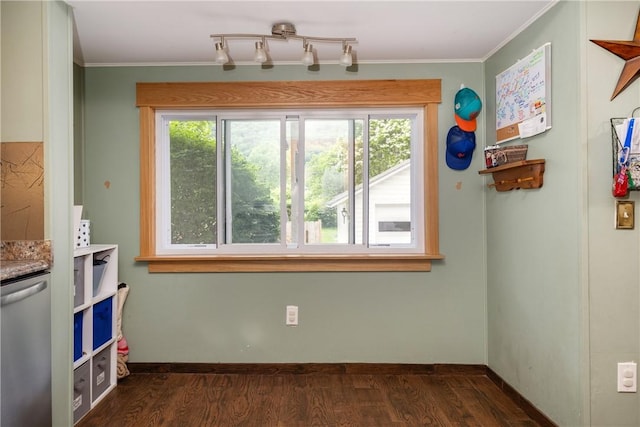 109 Oakwood Ave, Elmira, NY 14903 - dining area with dark wood-type flooring, ornamental molding, and rail lighting