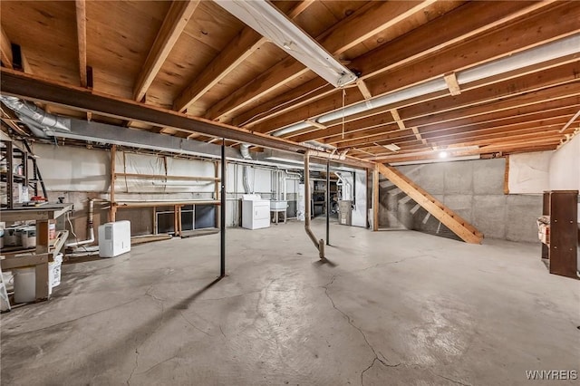 295 Continental Dr, Lockport City, NY 14094 - unfinished basement featuring independent washer and dryer and a sink