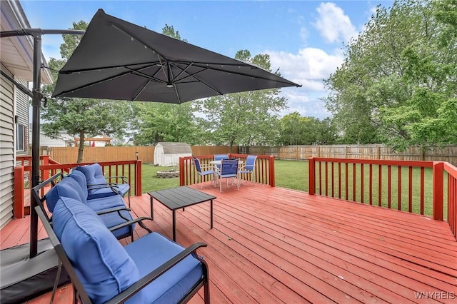 295 Continental Dr, Lockport City, NY 14094 - deck featuring outdoor dining space, a storage shed, and a fenced backyard