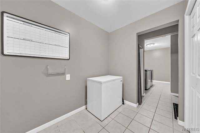 295 Continental Dr, Lockport City, NY 14094 - laundry room with light tile patterned flooring and washer / dryer