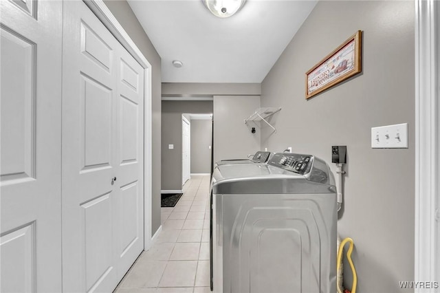 295 Continental Dr, Lockport City, NY 14094 - washroom featuring separate washer and dryer and light tile patterned floors
