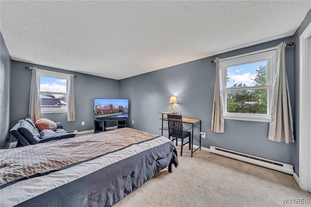 295 Continental Dr, Lockport City, NY 14094 - bedroom featuring baseboard heating, a textured ceiling, and carpet