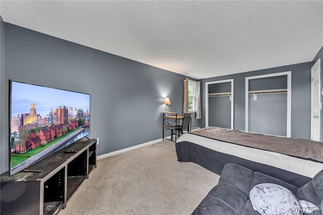 295 Continental Dr, Lockport City, NY 14094 - bedroom with carpet, multiple closets, and a textured ceiling