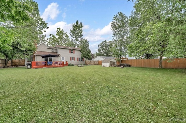 295 Continental Dr, Lockport City, NY 14094 - fenced backyard with a deck and a storage shed