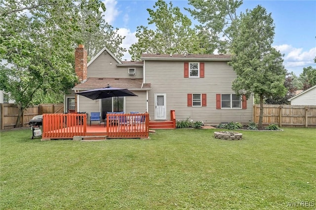 295 Continental Dr, Lockport City, NY 14094 - rear view of property featuring a fenced backyard, a wooden deck, and a chimney