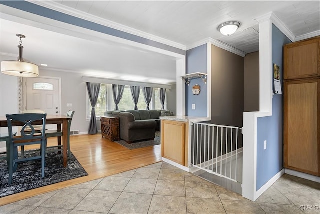 129 Butternut Dr, Dewitt, NY 13214 - living area featuring light tile patterned flooring and ornamental molding