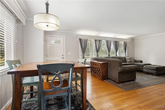 129 Butternut Dr, Dewitt, NY 13214 - dining area featuring ornamental molding, healthy amount of natural light, and light wood-style floors
