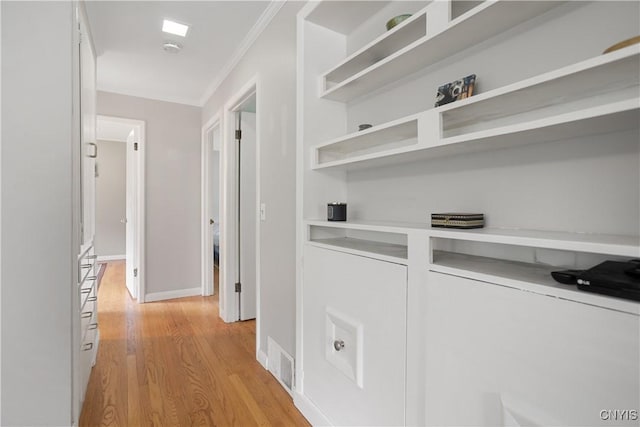 129 Butternut Dr, Dewitt, NY 13214 - hallway with ornamental molding and light wood-style flooring