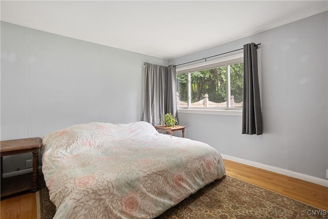 129 Butternut Dr, Dewitt, NY 13214 - bedroom with wood finished floors and baseboards
