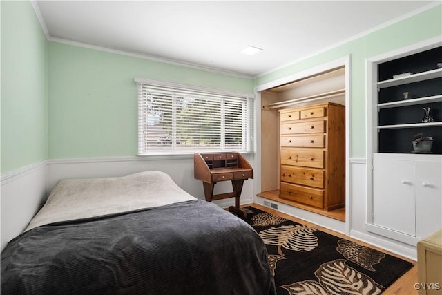 129 Butternut Dr, Dewitt, NY 13214 - bedroom featuring ornamental molding and wood finished floors