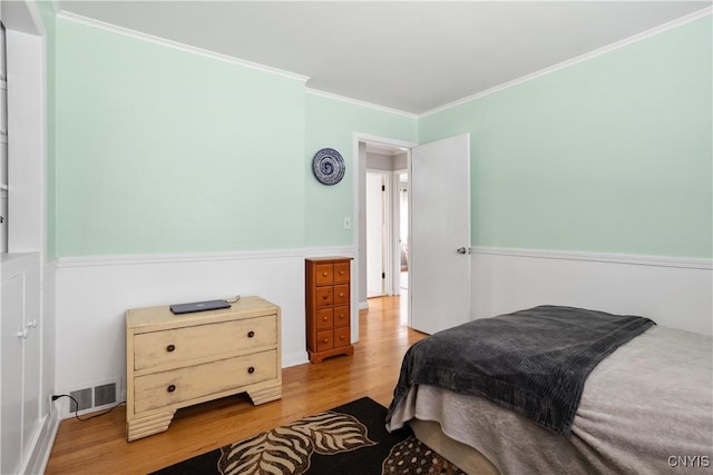 129 Butternut Dr, Dewitt, NY 13214 - bedroom with wood finished floors and ornamental molding