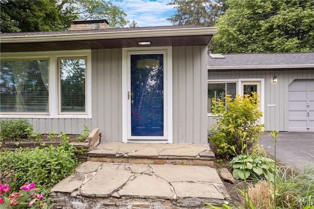 129 Butternut Dr, Dewitt, NY 13214 - property entrance featuring a chimney and a shingled roof
