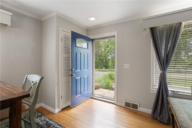 129 Butternut Dr, Dewitt, NY 13214 - entrance foyer featuring light wood-style flooring and ornamental molding