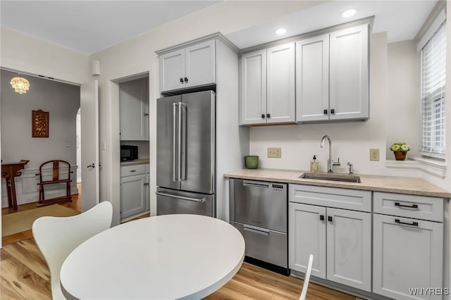 33 Gates Cir Unit 6B, Buffalo, NY 14222 - kitchen with appliances with stainless steel finishes, light countertops, light wood finished floors, and recessed lighting