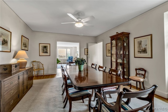 33 Gates Cir Unit 6B, Buffalo, NY 14222 - dining space with ceiling fan and light wood-style flooring