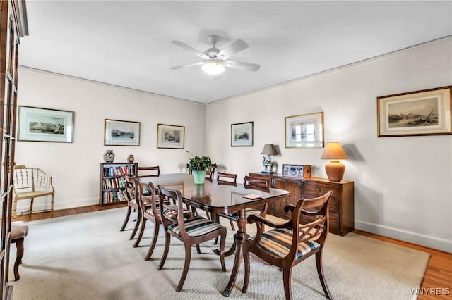 33 Gates Cir Unit 6B, Buffalo, NY 14222 - dining area with a ceiling fan and wood finished floors