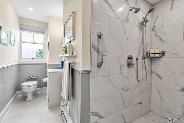 33 Gates Cir Unit 6B, Buffalo, NY 14222 - bathroom featuring a wainscoted wall, a tile shower, and a baseboard heating unit