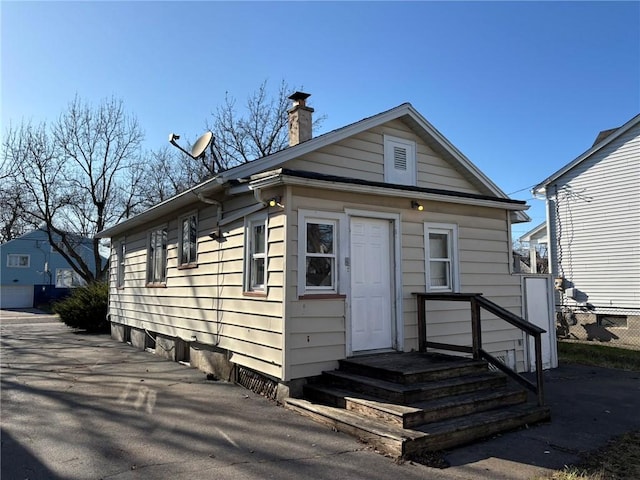 92 Abbott St, Rochester, NY 14606 - view of front of house with a chimney