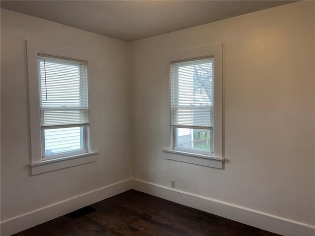 92 Abbott St, Rochester, NY 14606 - spare room with dark wood-type flooring and baseboards