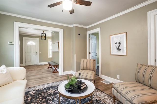 69 Diem St, Rochester, NY 14620 - living area featuring wood finished floors, ornamental molding, and a ceiling fan