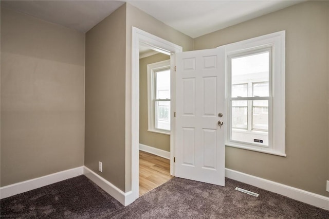 69 Diem St, Rochester, NY 14620 - carpeted entrance foyer featuring baseboards