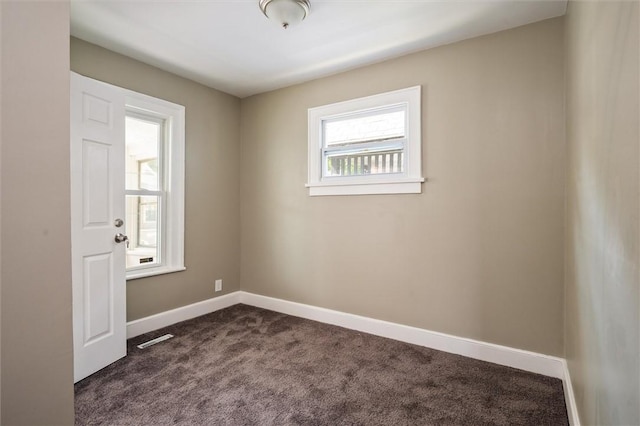 69 Diem St, Rochester, NY 14620 - unfurnished room featuring dark carpet and baseboards