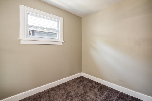 69 Diem St, Rochester, NY 14620 - empty room with dark carpet and baseboards