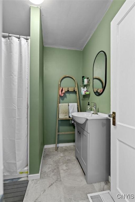133 Bryant Ave, Syracuse, NY 13204 - bathroom featuring vanity, curtained shower, and marble look tiles