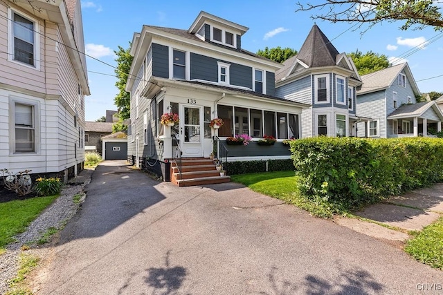 133 Bryant Ave, Syracuse, NY 13204 - view of front of house featuring driveway, a detached garage, and an outdoor structure