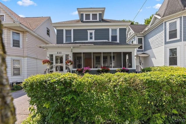133 Bryant Ave, Syracuse, NY 13204 - back of property with a sunroom and roof with shingles