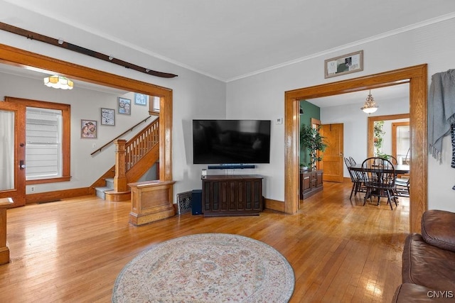133 Bryant Ave, Syracuse, NY 13204 - living area with wood-type flooring, stairway, and ornamental molding
