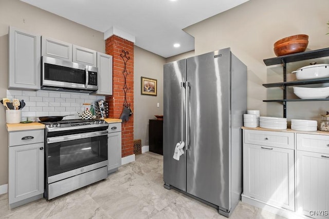 133 Bryant Ave, Syracuse, NY 13204 - kitchen with stainless steel appliances, tasteful backsplash, light countertops, light marble finish flooring, and recessed lighting