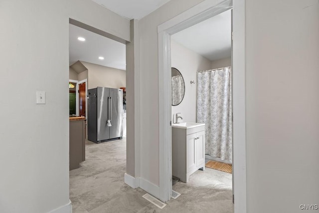 133 Bryant Ave, Syracuse, NY 13204 - corridor with a sink and recessed lighting