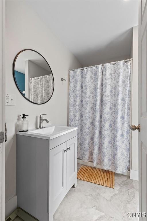133 Bryant Ave, Syracuse, NY 13204 - bathroom featuring vanity and marble look tiles