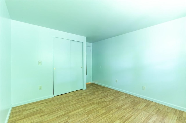 10 Chesfield Lookout, Perinton, NY 14450 - unfurnished bedroom featuring light wood finished floors and a closet