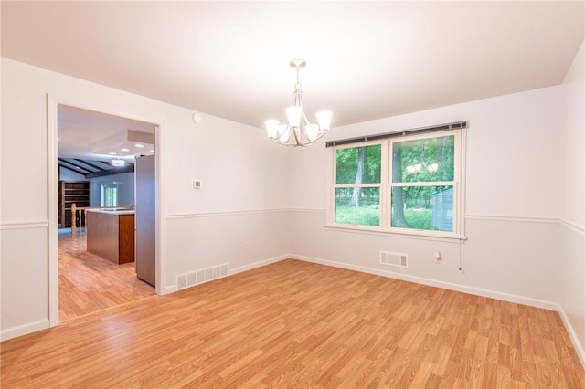 10 Chesfield Lookout, Perinton, NY 14450 - spare room with light wood finished floors and a chandelier