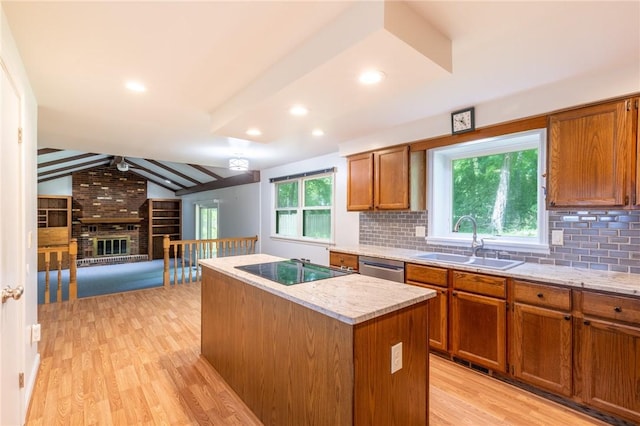 10 Chesfield Lookout, Perinton, NY 14450 - kitchen with cooktop, a center island, a ceiling fan, brown cabinets, and recessed lighting