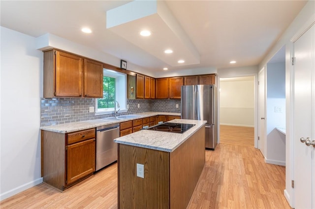 10 Chesfield Lookout, Perinton, NY 14450 - kitchen featuring stainless steel appliances, light wood finished floors, tasteful backsplash, a center island, and recessed lighting