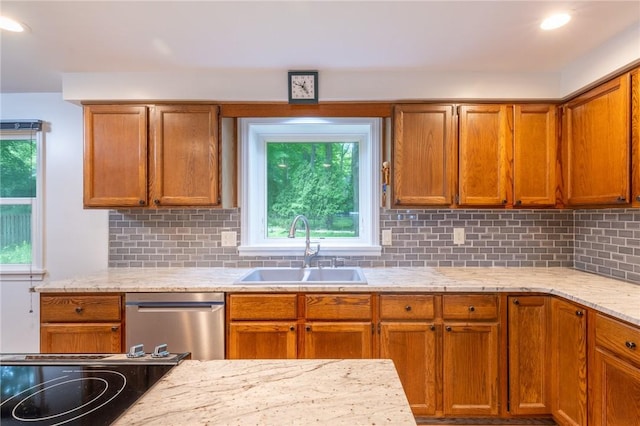 10 Chesfield Lookout, Perinton, NY 14450 - kitchen featuring dishwasher, decorative backsplash, light stone countertops, brown cabinetry, and recessed lighting