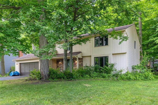 10 Chesfield Lookout, Perinton, NY 14450 - view of front of property with asphalt driveway, an attached garage, and a front yard